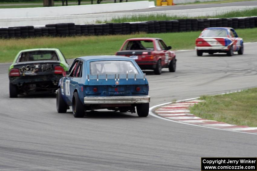 Four cars head through turn 13