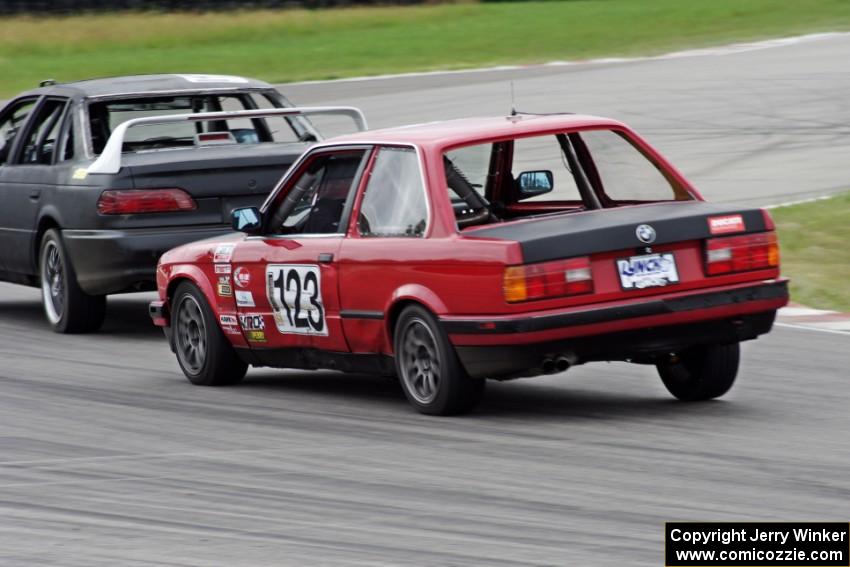 Blunderbus(t) BMW 318 trails the Wheels Off Racing Ford Taurus SHO