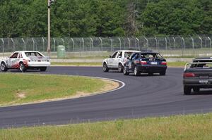 Four cars dive through turn 4