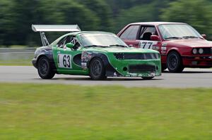 Miaro Racing Mazda Miata passes the Probs Racing BMW 325