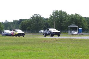 Nienow Racing Chevy Cavalier Z-24, Nile Racing (Senile & Juvenile) VW GTI and Flying Circus BMW 325i at turn 4