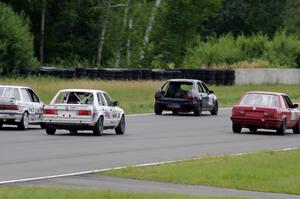 Four cars dive into turn 2