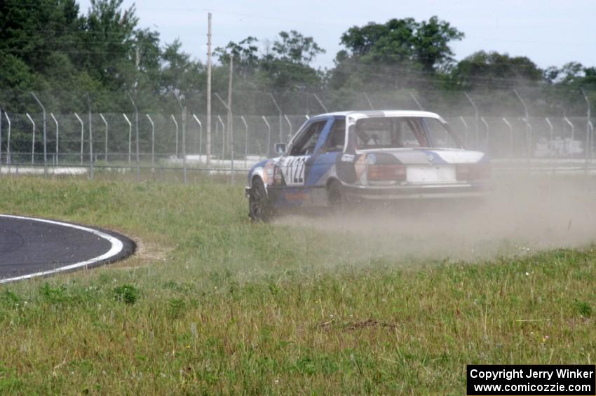 The Most Interesting Chumps In The World BMW 325i goes off at turn 4