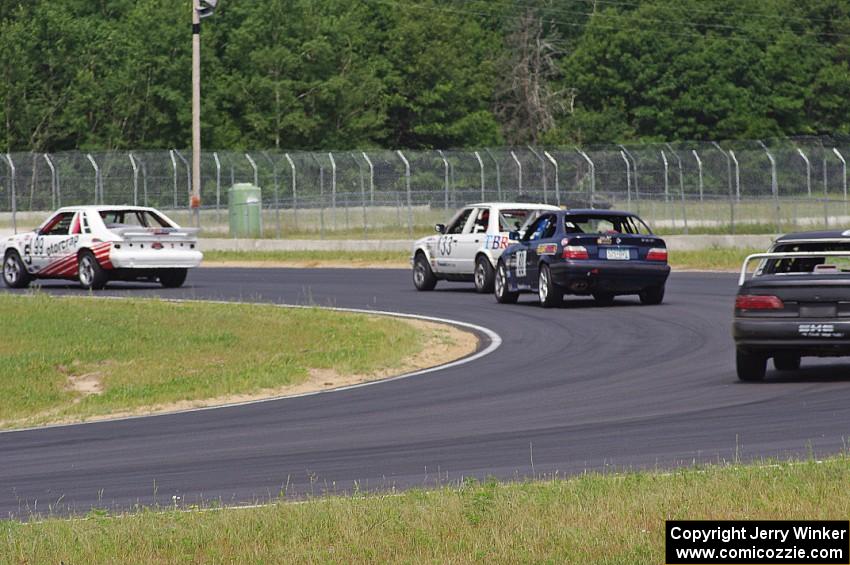 Four cars dive through turn 4