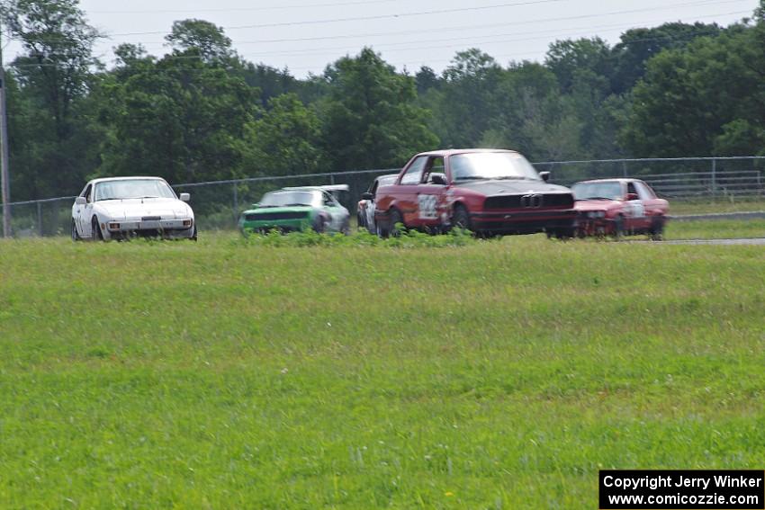 Five cars head through turn 4