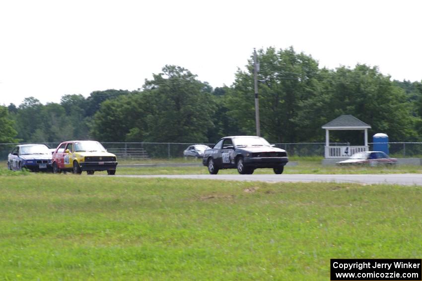 Nienow Racing Chevy Cavalier Z-24, Nile Racing (Senile & Juvenile) VW GTI and Flying Circus BMW 325i at turn 4