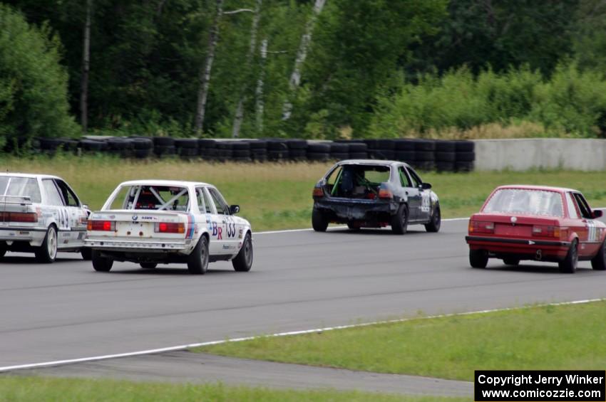 Four cars dive into turn 2