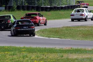 Four cars exit the carousel