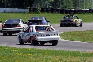 Five cars exit the carousel