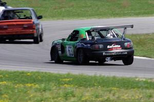 Miaro Racing Mazda Miata chases the North Loop Motorsports 1 BMW 325