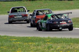 Chump Faces BMW 325is, North Loop Motorsports 1 BMW 325 and Miaro Racing Mazda Miata