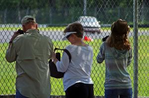 Spectators at the carousel fence