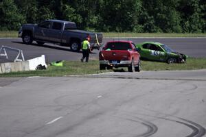 NNM Motorsports Dodge Neon is collected at turn 1 after an accident