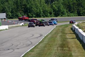 NNM Motorsports Dodge Neon is collected at turn 1 after an accident