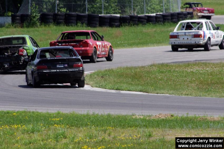 Four cars exit the carousel