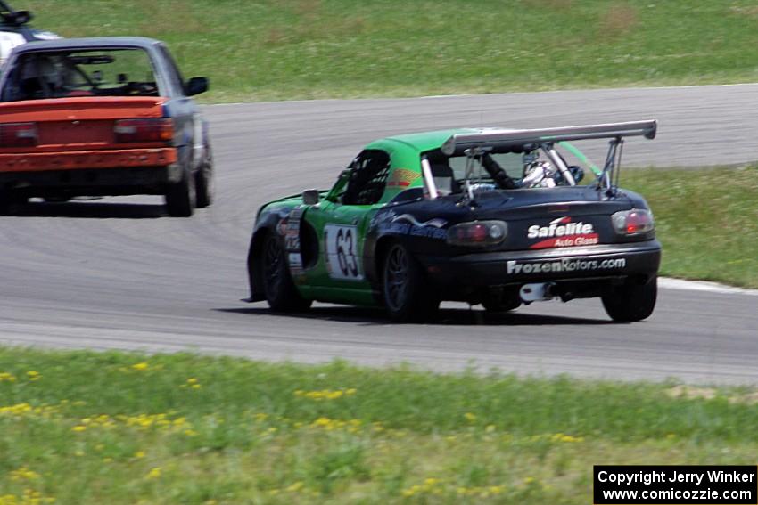 Miaro Racing Mazda Miata chases the North Loop Motorsports 1 BMW 325