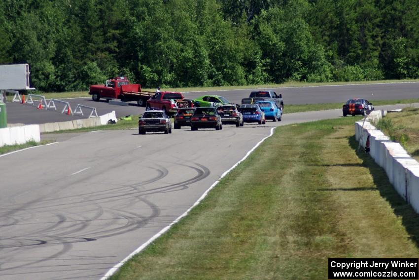 NNM Motorsports Dodge Neon is collected at turn 1 after an accident