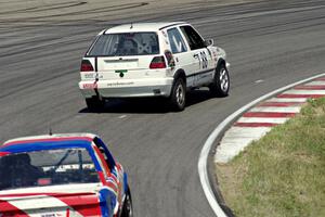 JAB Motorsport VW GTI and British American Racing BMW 318i