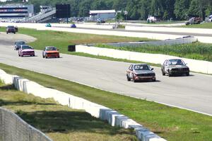 Five cars head down the front straight