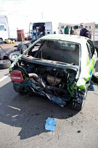 NNM Motorsports Dodge Neon showing the impact of the wreck. Note the engine is in the trunk!