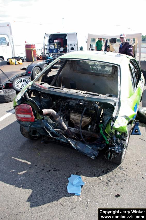 NNM Motorsports Dodge Neon showing the impact of the wreck. Note the engine is in the trunk!