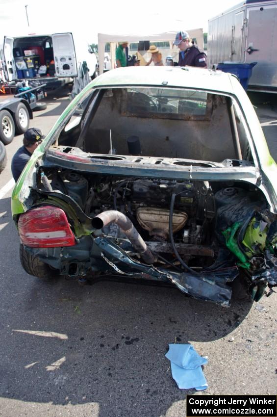 NNM Motorsports Dodge Neon showing the impact of the wreck. Note the engine is in the trunk!