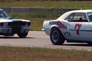 Shannon Ivey's Chevy Camaro leads Brian Kennedy's Ford Shelby GT350 into turn 4