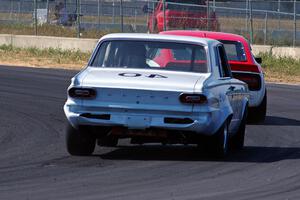 Gary Davis's Dodge Dart chases Jerry Dulski's Datsun 240Z