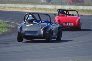 Tom Daly's Austin-Healey Sprite leads Phil Schaefer's Austin-Healey Sprite through turn 4