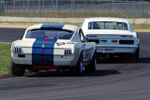 Shannon Ivey's Chevy Camaro leads Brian Kennedy's Ford Shelby GT350 at turn 4