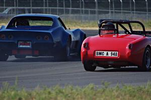 Darwin Bosell's Chevy Corvette passes Tom Daly's Austin-Healey Sprite