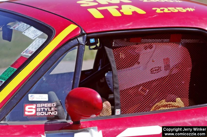 Greg Youngdahl sits in his Spec Miata Mazda Miata