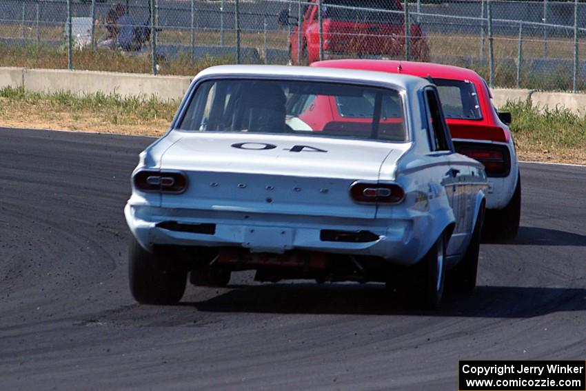 Gary Davis's Dodge Dart chases Jerry Dulski's Datsun 240Z