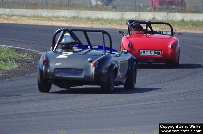 Tom Daly's Austin-Healey Sprite leads Phil Schaefer's Austin-Healey Sprite through turn 4