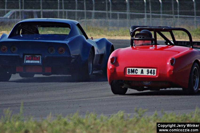 Darwin Bosell's Chevy Corvette passes Tom Daly's Austin-Healey Sprite