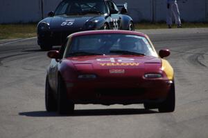 Greg Youngdahl's ITA Mazda Miata followed by Phil Magney's ITE-2 Porsche 993