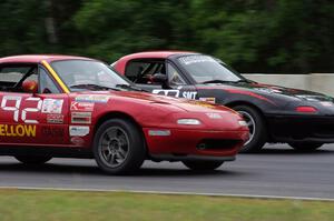 Greg Youngdahl's Spec Miata Mazda Miata passes Chris Bienert's Spec Miata Mazda Miata