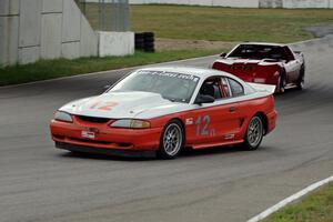 Tom Fuehrer's T1 Ford Mustang and Chris Johnson's ITE-1 Chevy Corvette