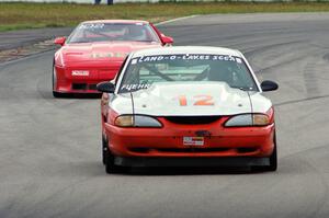 Tom Fuehrer's T1 Ford Mustang and Chris Johnson's ITE-1 Chevy Corvette