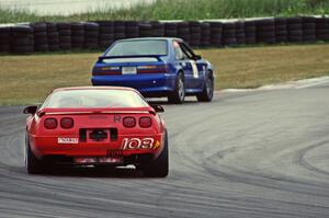 Chris Johnson's ITE-1 Chevy Corvette chases Damon Bosell's ITE-1 Ford Mustang