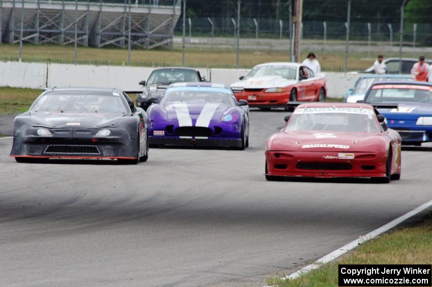 The eight cars for race group 2 line up for the green flag.