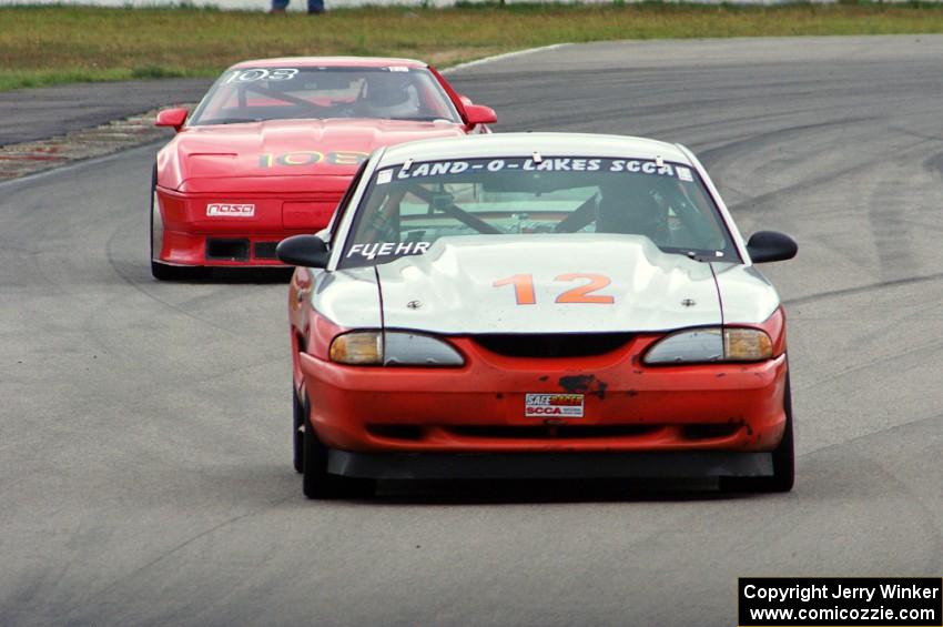 Tom Fuehrer's T1 Ford Mustang and Chris Johnson's ITE-1 Chevy Corvette