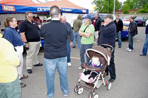 A group of people conversing and enjoying Rallyfest.