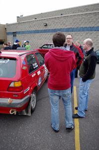 John Kimmes talks to rally fans next to the VW GTI he shares with Greg Smith.