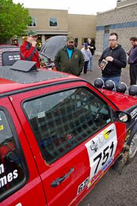 John Kimmes talks to Pete Winters and Breon Nagy next to the VW GTI he shares with Greg Smith.