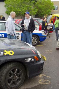 Dave Goodman and Kerry Freund chat between the Anthony Israelson / Jason Standage Subaru Impreza and Amy Springer Subaru Legacy.