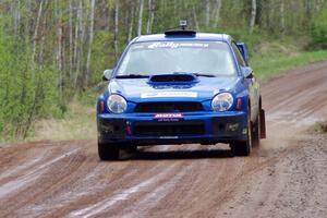 Janusz Topor / Michal Kaminski at speed on stage one in their Subaru WRX STi.