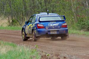 Janusz Topor / Michal Kaminski at speed on stage one in their Subaru WRX STi.