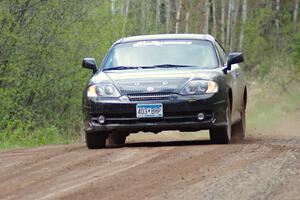 The Derek McCorison / Paul Johansen Hyundai Tiburon at speed on stage one.