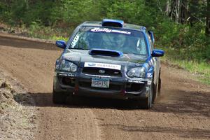 The Carl Siegler/ David Goodman Subaru WRX STi exits a sweeper on stage two.